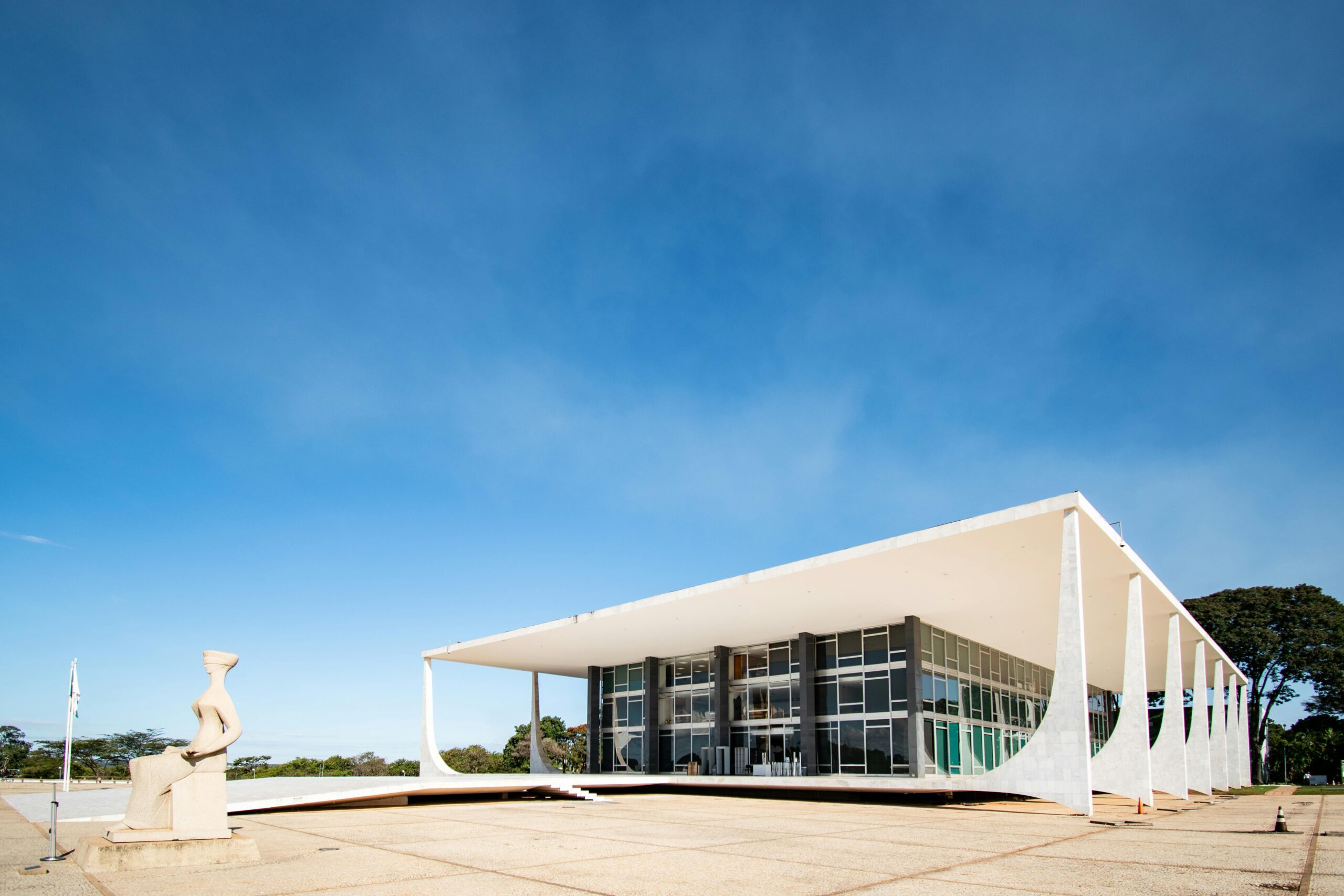 Modernist architecture of Supreme Federal Court, Bras&iacute;lia under clear blue skies.